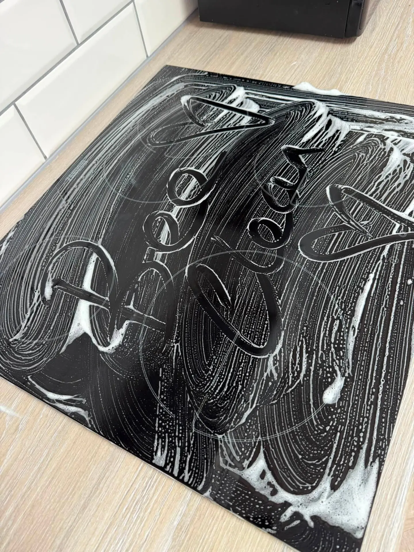 Bee Clean Solutions cleaning a personalised entrance mat